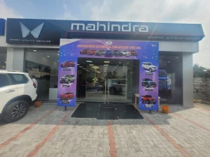 Mahindra Automotive Showroom logo