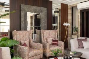 Nature-Inspired Elegance: A Living Room Oasis with Cream Accents and Lush Greenery